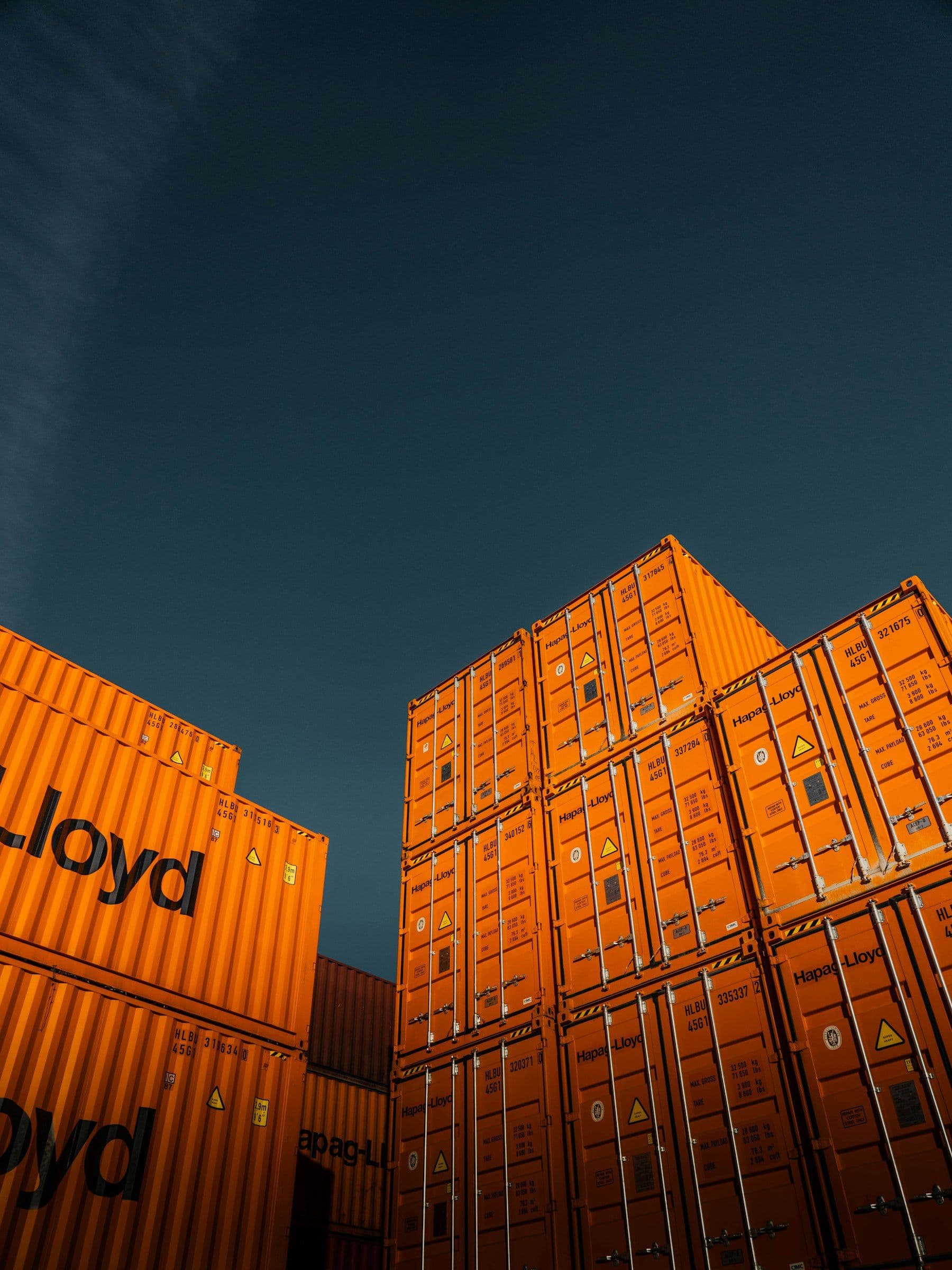 Stacked orange shipping containers