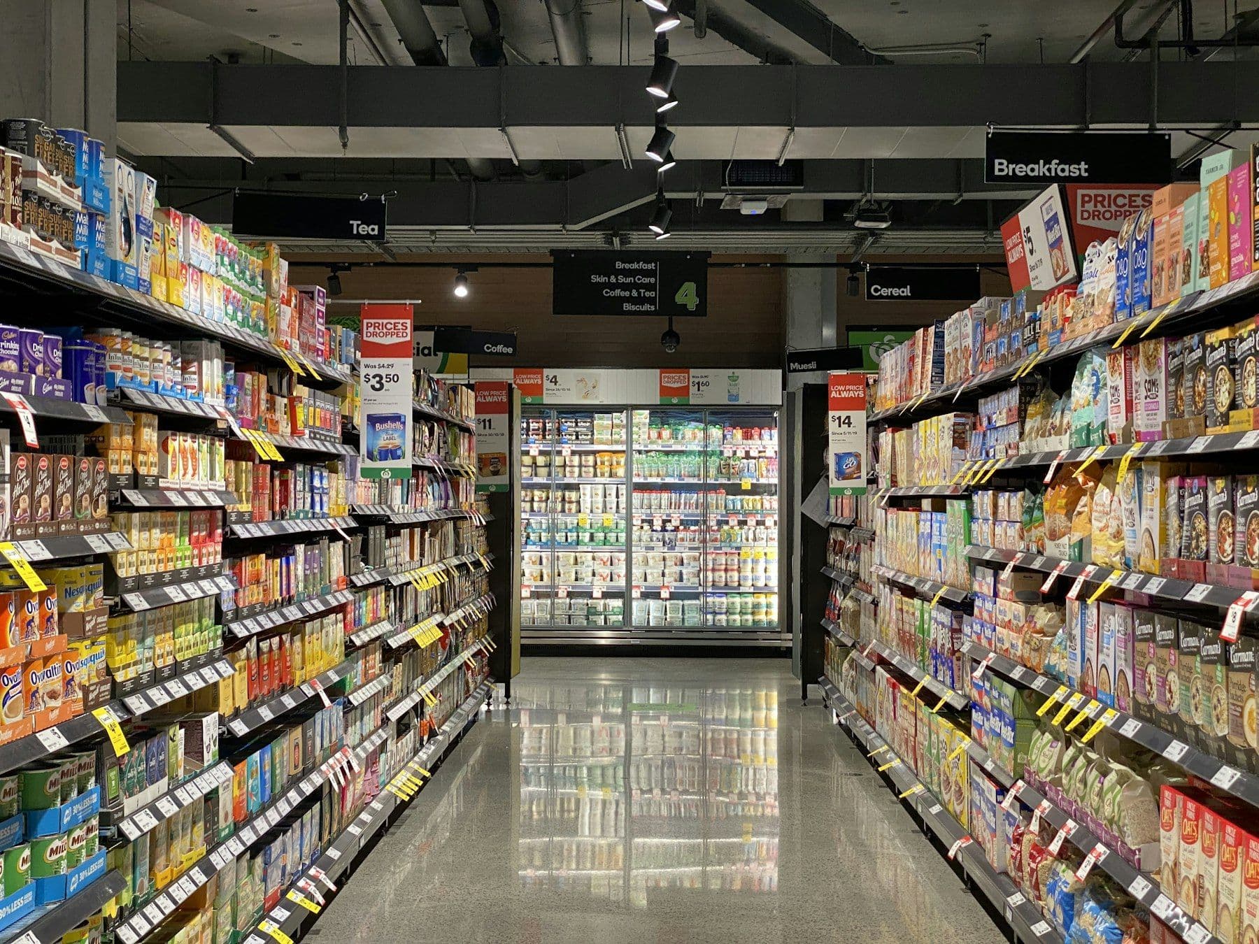Supermarket aisle with fully stocked shelves