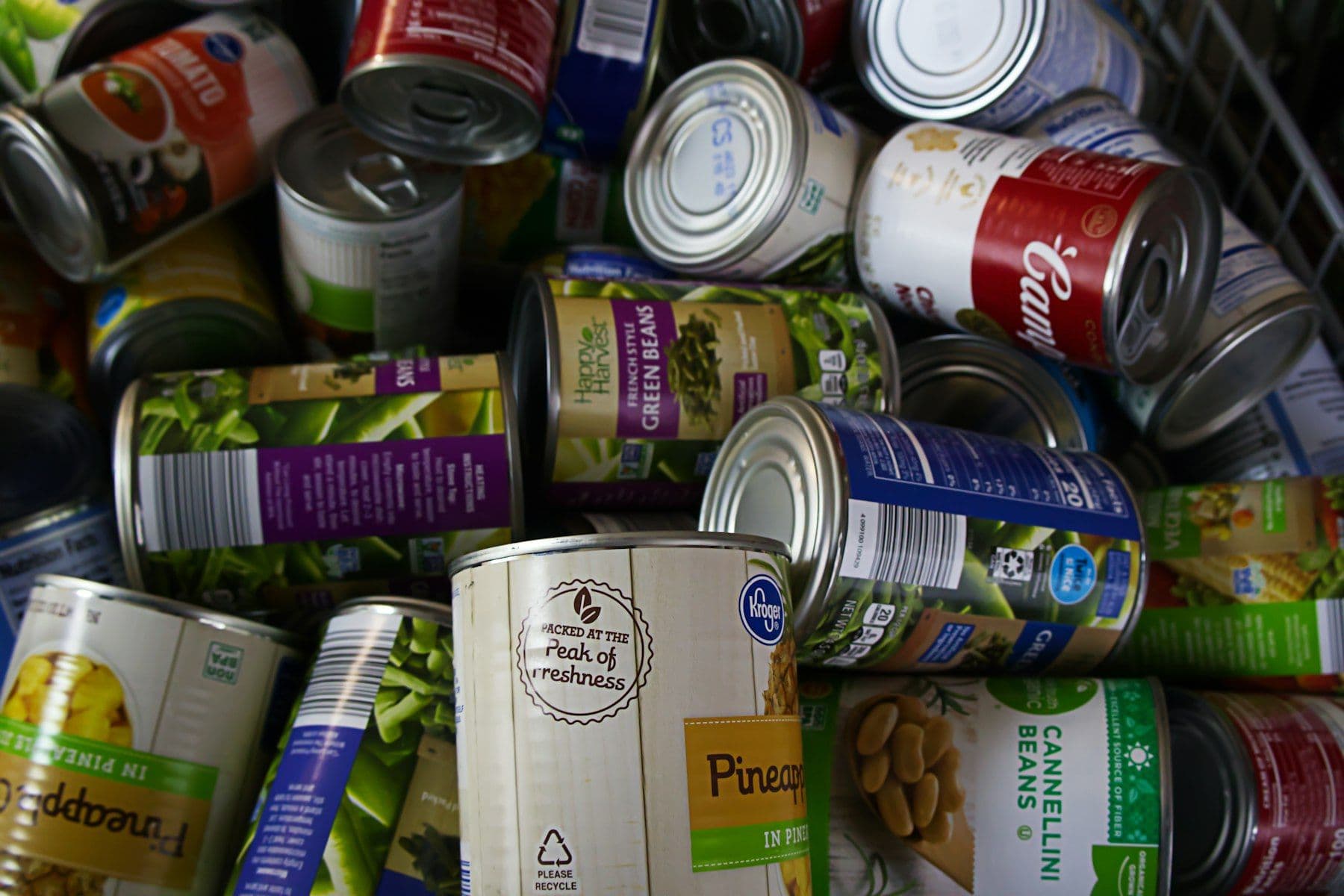 A pile of tinned food cans